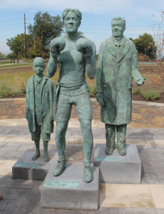 Featherweight boxing champion Johnny Kilbane statue in Cleveland showing the 3 stages of his life.