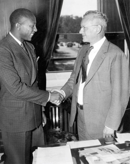 Cleveland hero and Olympian Jesse Owens meeting with Kansas Governor Alfred Landon in 1936